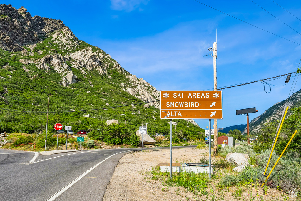 View of asphalt street with traffic signs and a mountain view