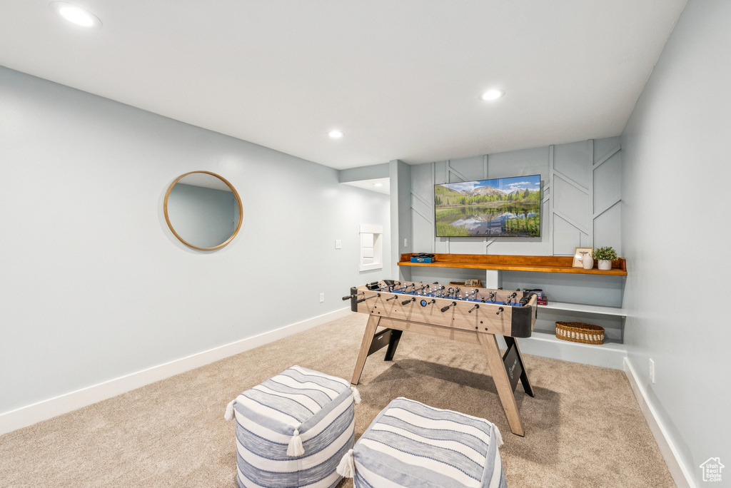 Recreation room featuring carpet flooring and recessed lighting