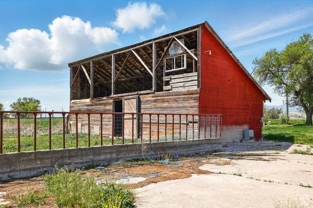 View of side of home with an outdoor structure and an exterior structure