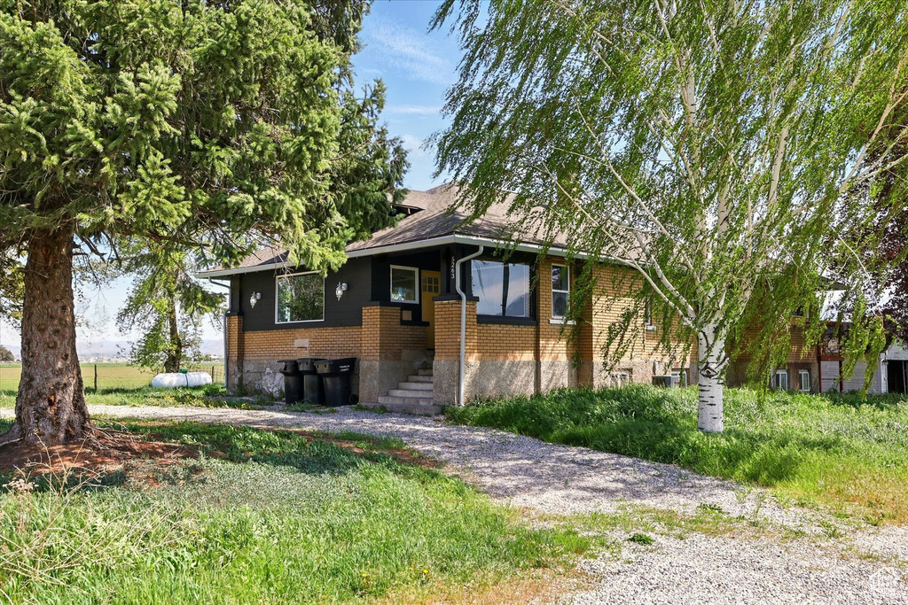 View of front of house with brick siding