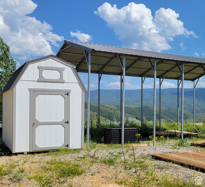 View of shed with a mountain view