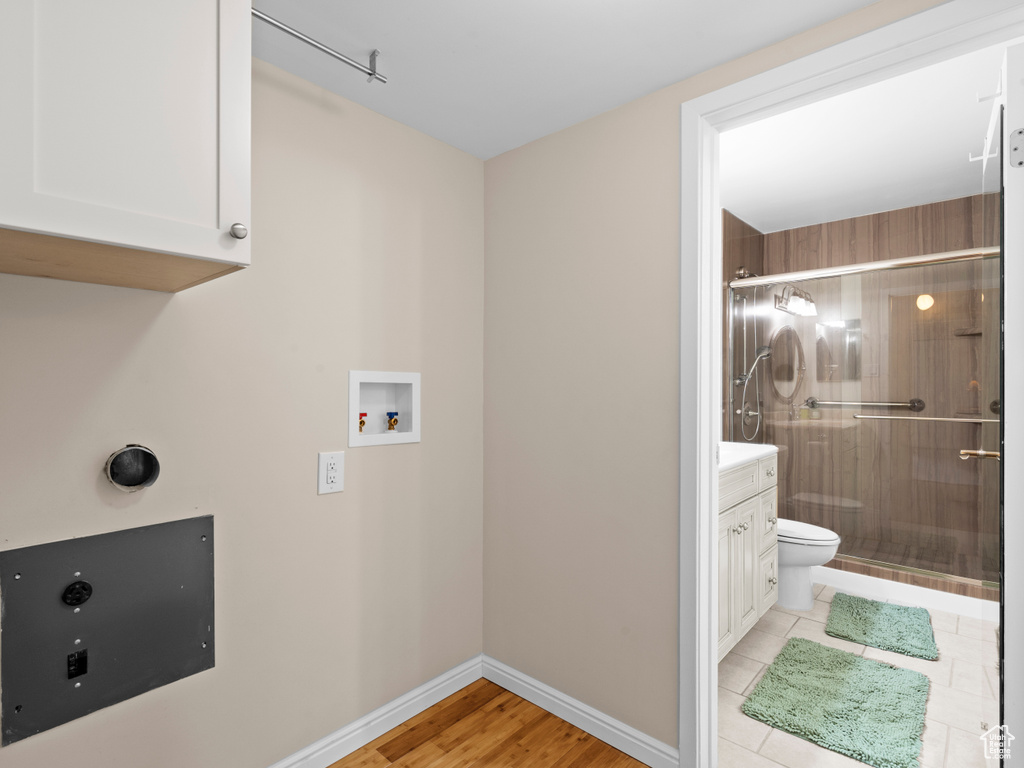 Laundry area with cabinet space and washer hookup