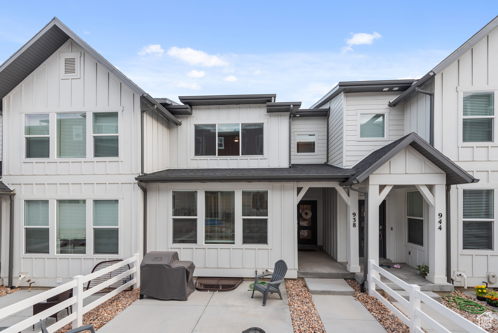 Townhome / multi-family property featuring board and batten siding