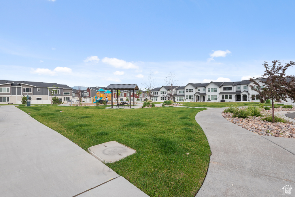 View of property's community with a yard and a residential view