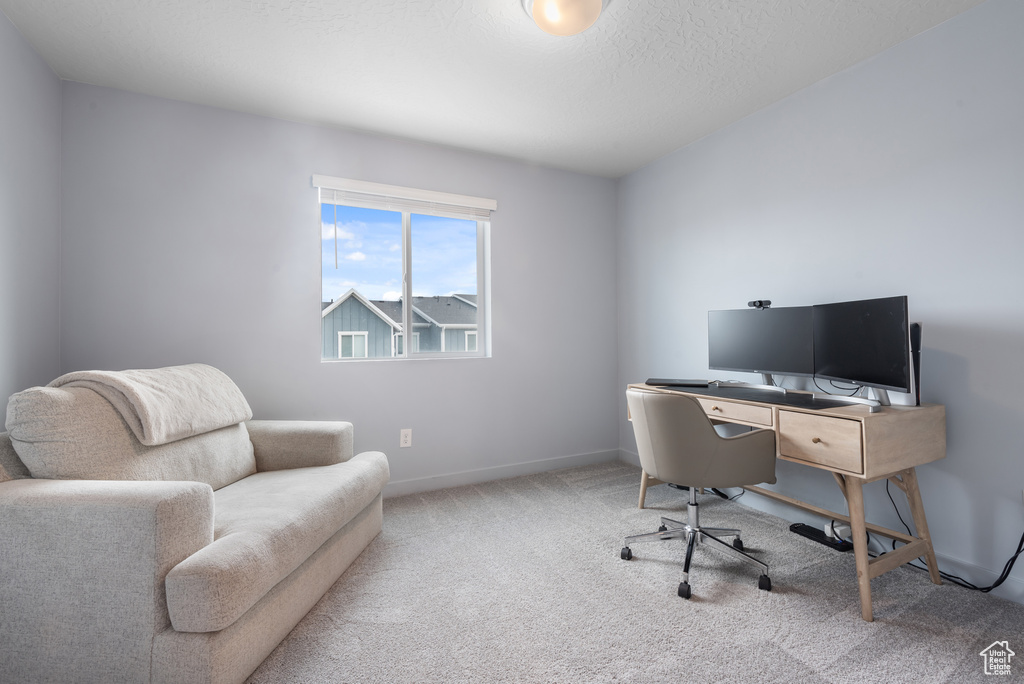 Office space featuring carpet and baseboards