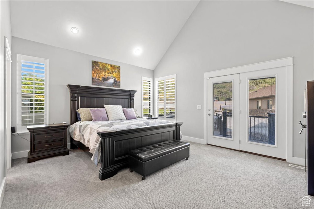 Carpeted bedroom featuring access to outside, high vaulted ceiling, and recessed lighting