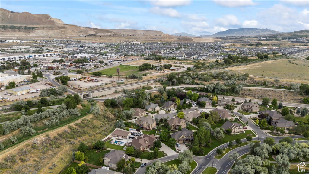 View of property location with a mountain backdrop and nearby suburban area