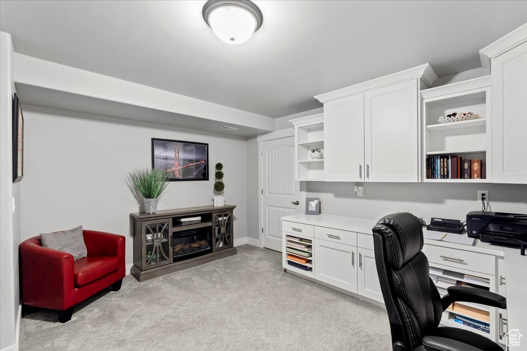 Office with light carpet and baseboards