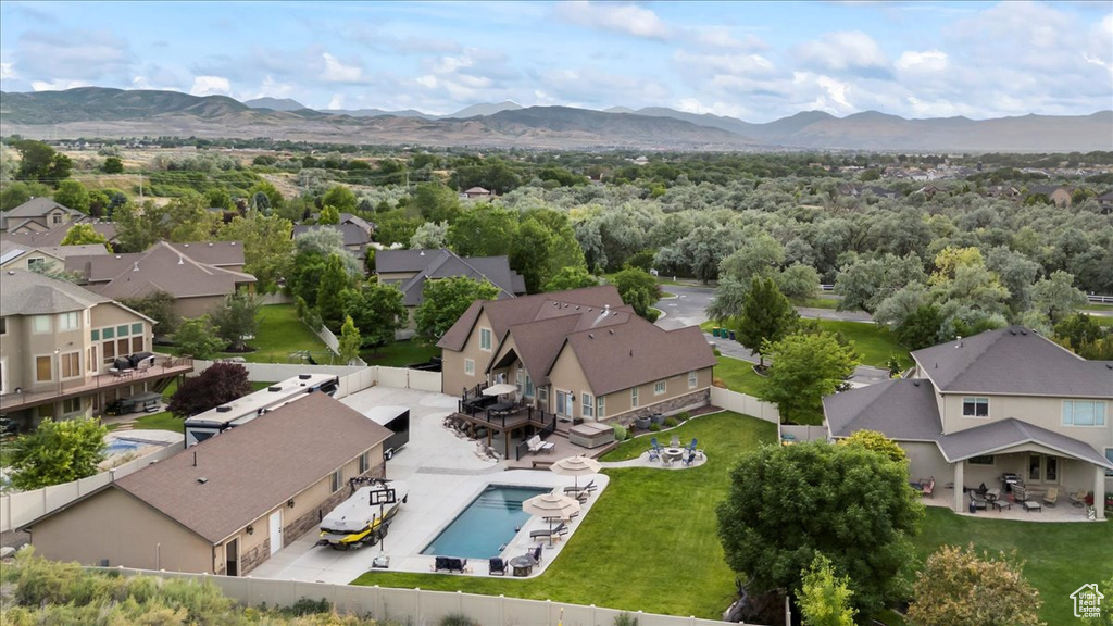 Aerial perspective of suburban area featuring a mountainous background