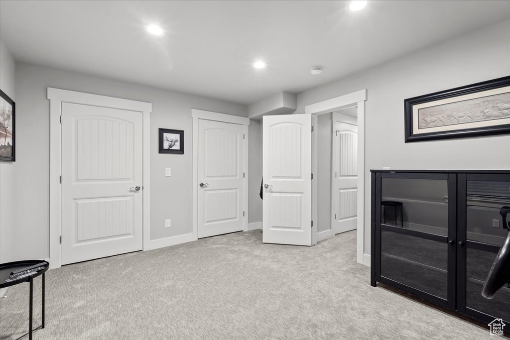 Unfurnished bedroom featuring carpet and recessed lighting