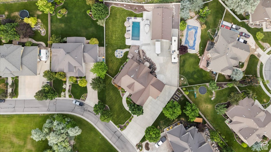 Aerial view of property and surrounding area with nearby suburban area