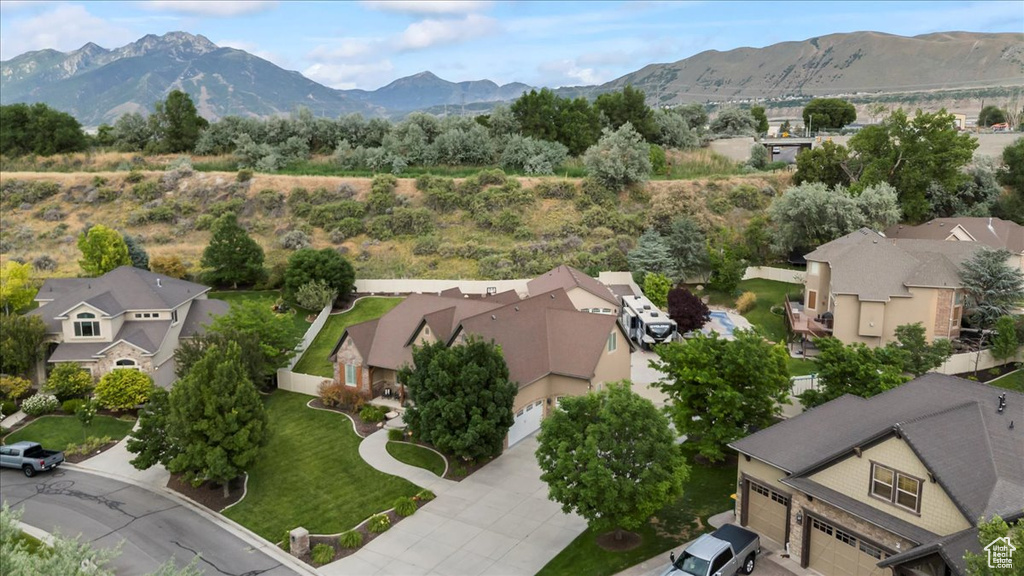 Aerial view of residential area featuring a mountain backdrop
