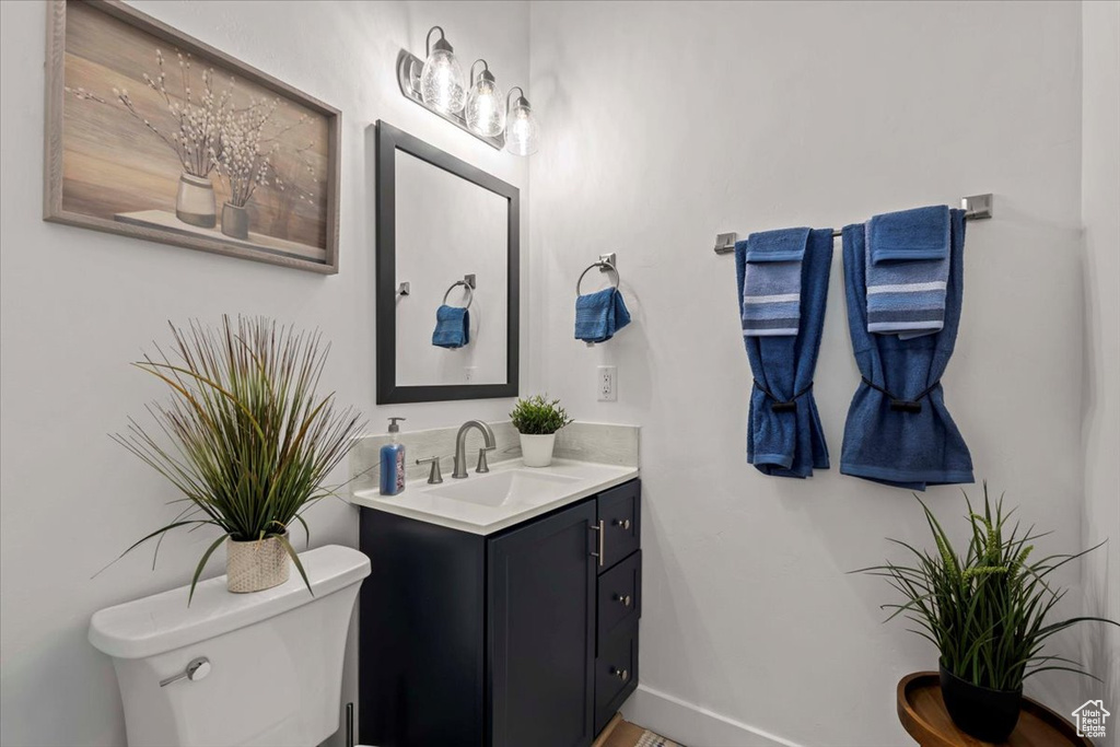 Bathroom featuring vanity and toilet