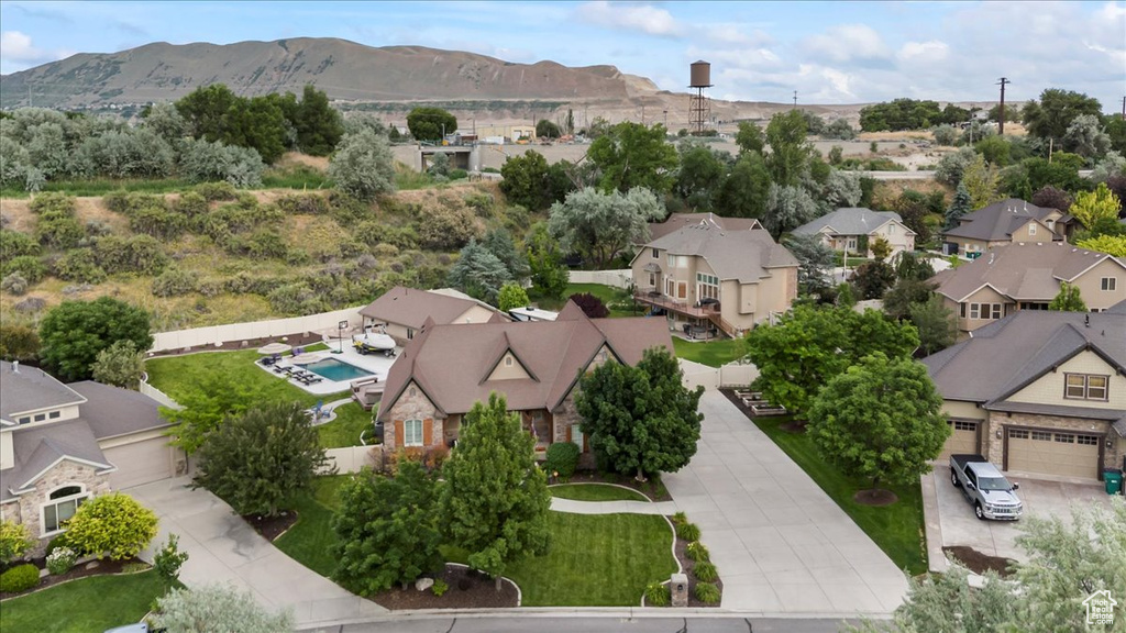 Aerial perspective of suburban area featuring a mountainous background