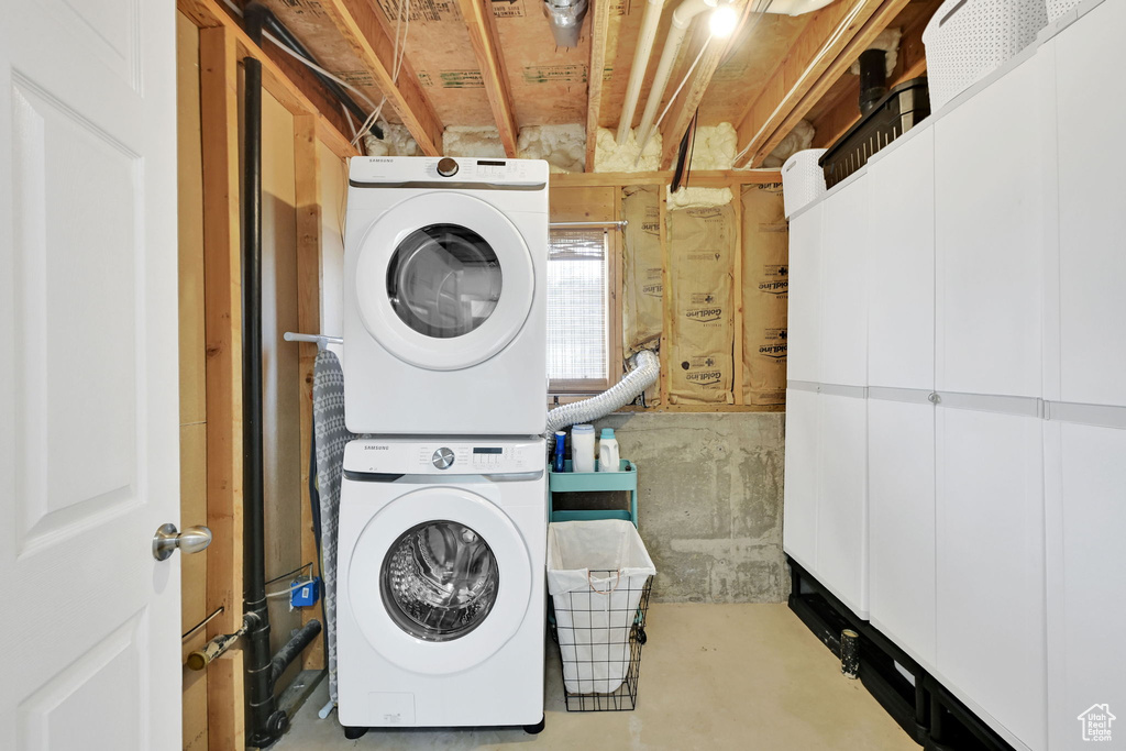 Laundry area with estacked washer and dryer