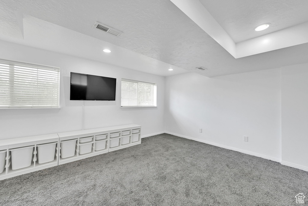 Carpeted spare room with recessed lighting and a textured ceiling