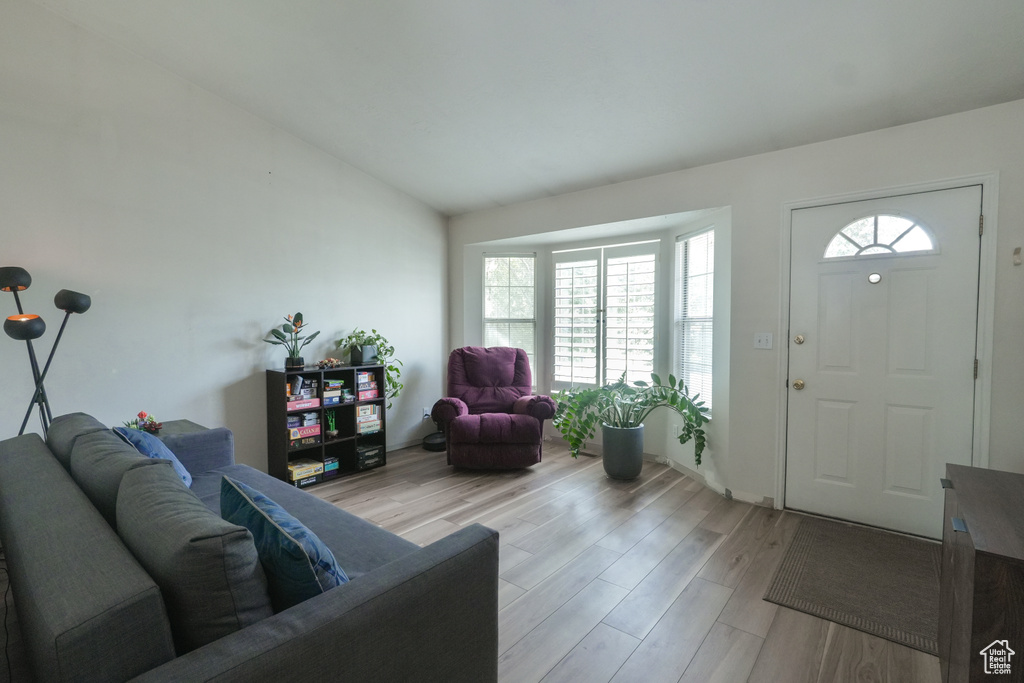 Living room with light wood-style flooring