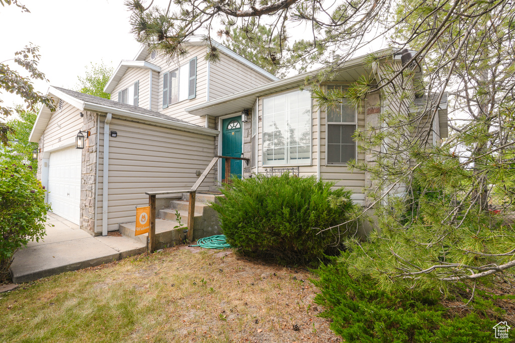 Tri-level home with a garage and driveway