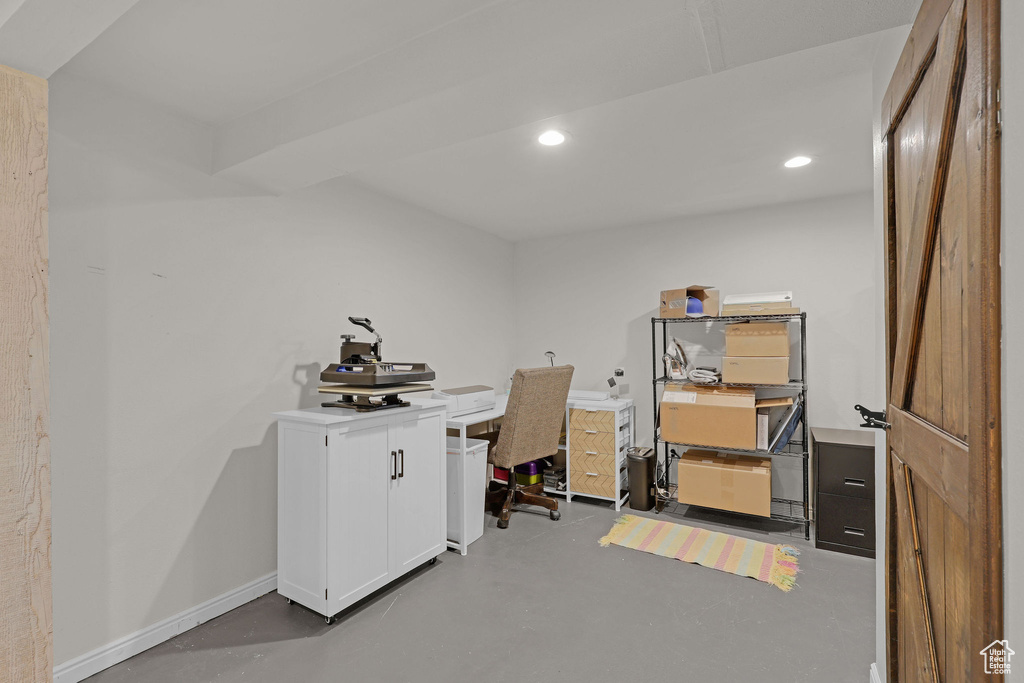 Office area featuring recessed lighting and finished concrete floors