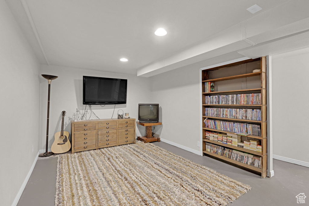 Living room featuring concrete flooring and recessed lighting