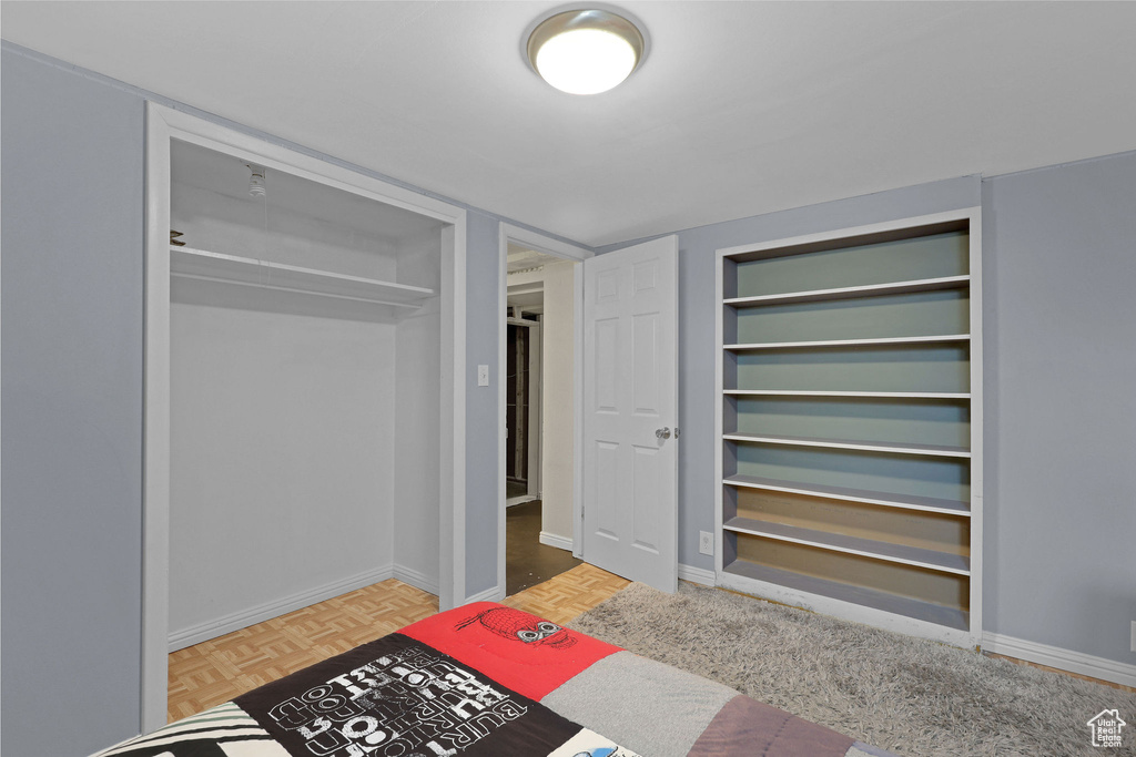Unfurnished bedroom with baseboards
