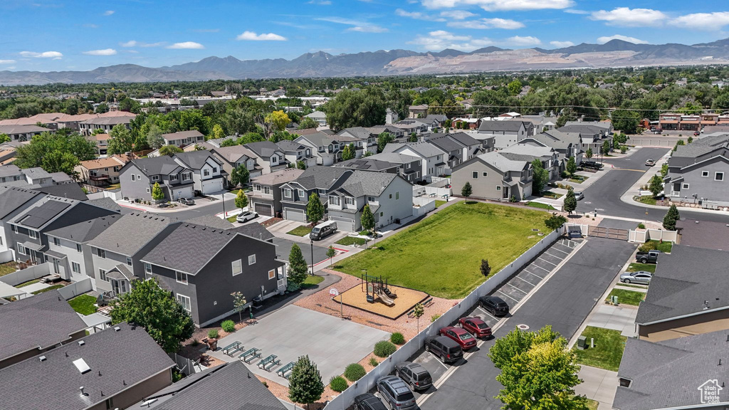 Aerial perspective of suburban area featuring a mountain backdrop