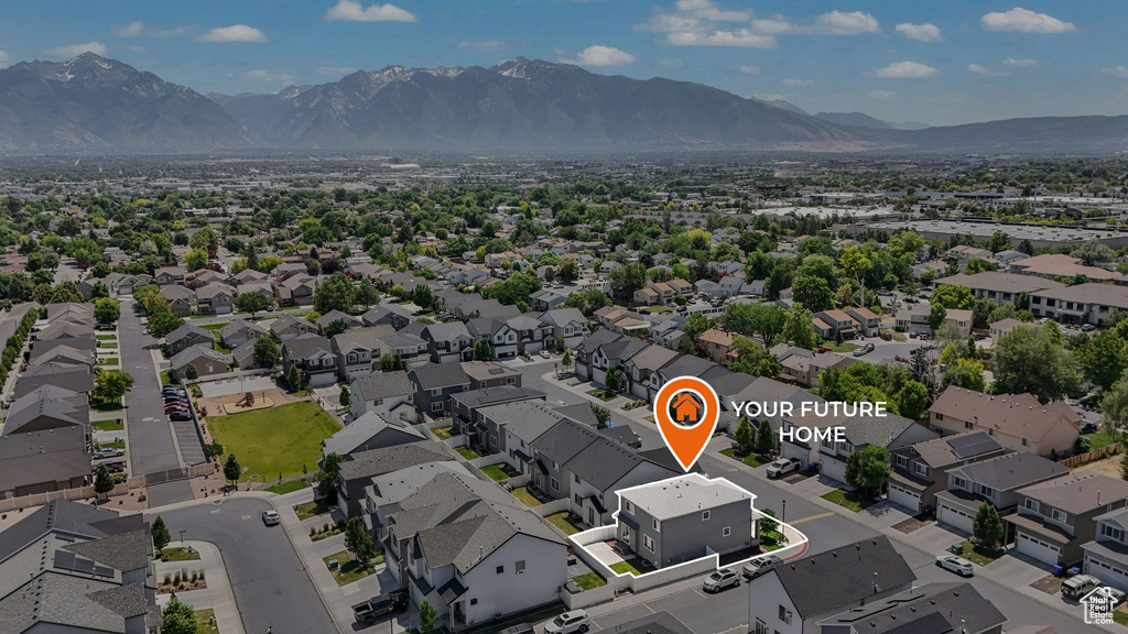 Aerial perspective of suburban area with a mountain backdrop
