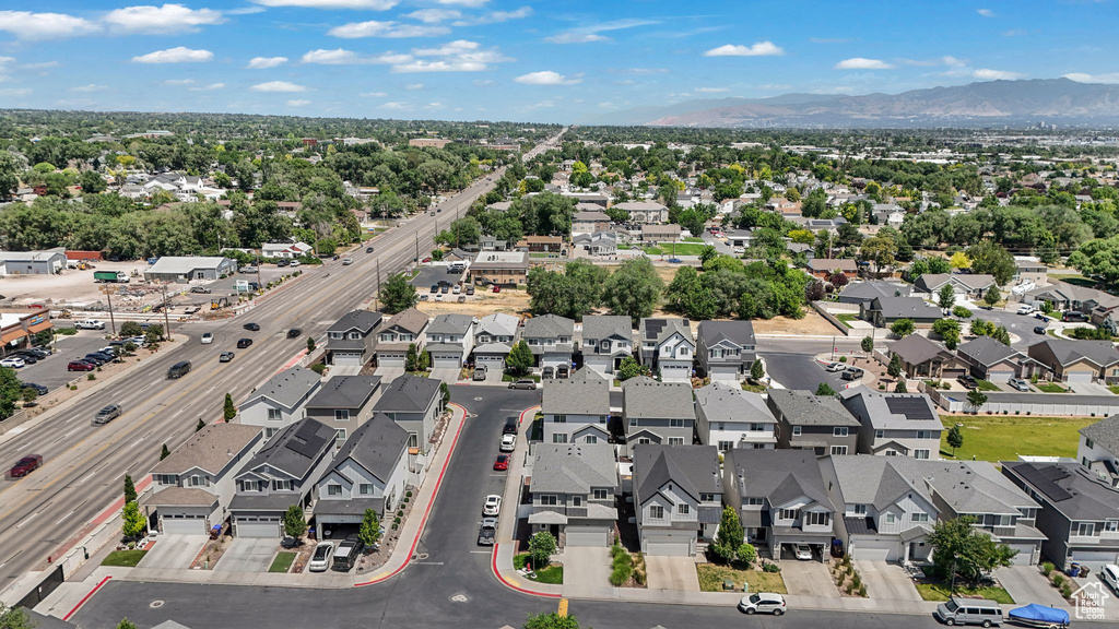 Aerial perspective of suburban area with a mountainous background