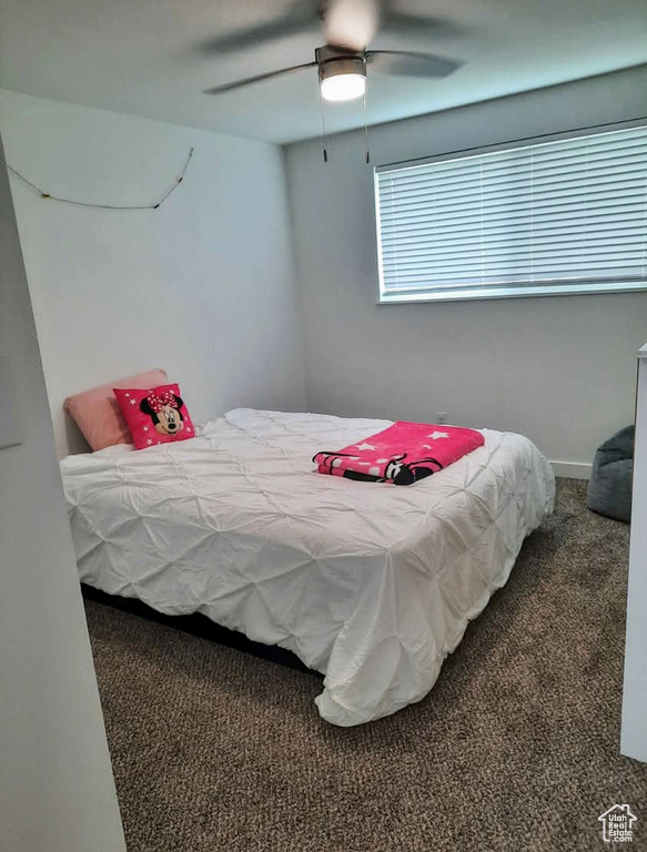 Bedroom featuring carpet and ceiling fan
