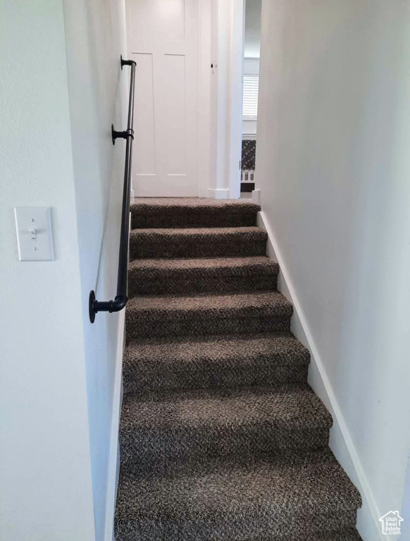 Stairs featuring baseboards