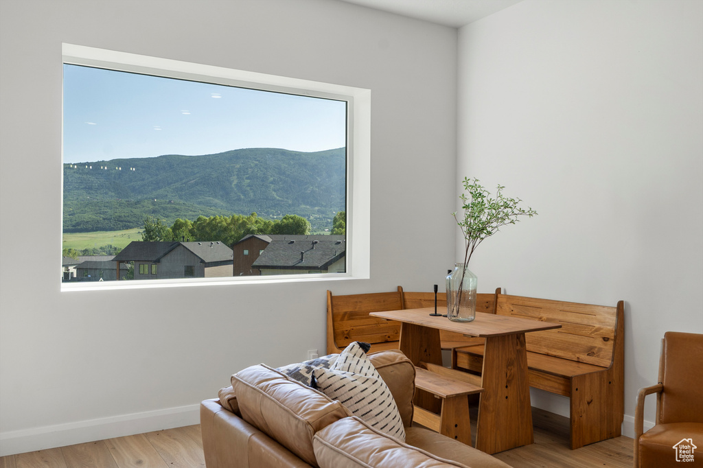 Living area with a mountain view and wood finished floors