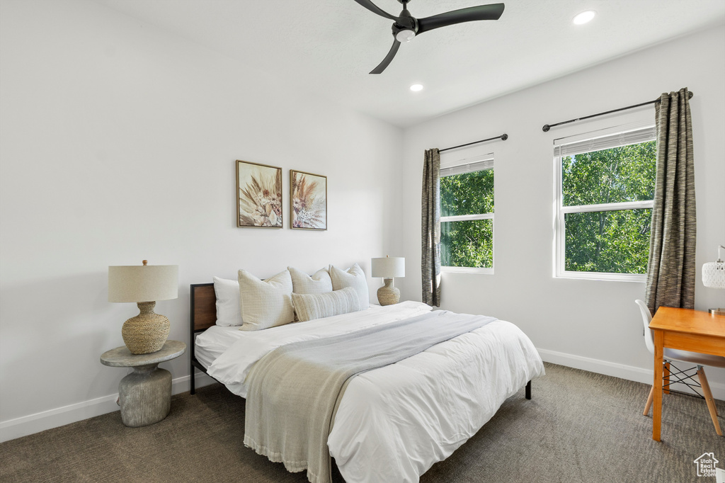 Carpeted bedroom with recessed lighting and a ceiling fan