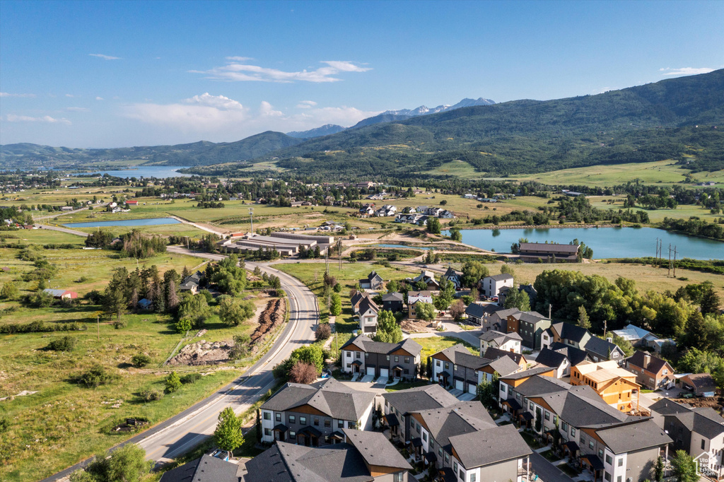 Aerial perspective of suburban area with a water and mountain view