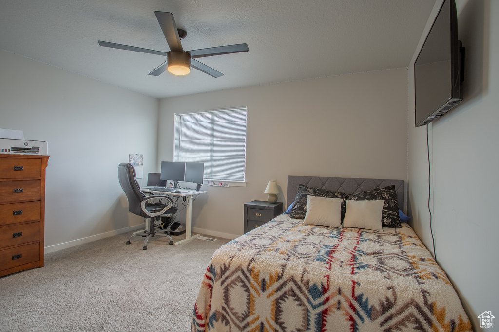 Bedroom with carpet and ceiling fan