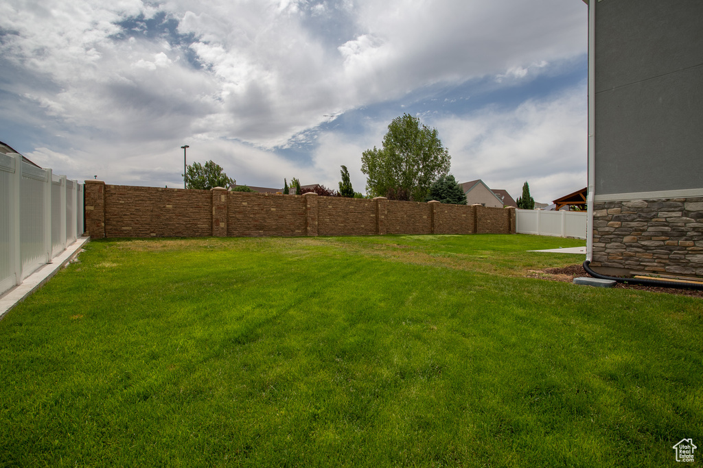 View of fenced backyard