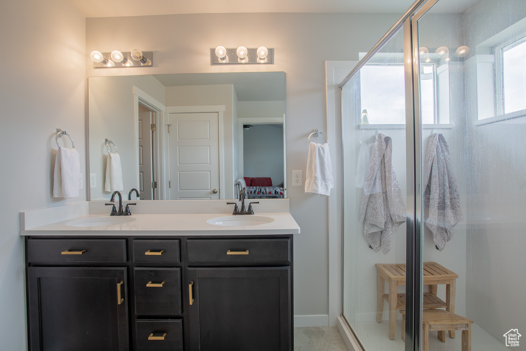 Ensuite bathroom with double vanity and a stall shower