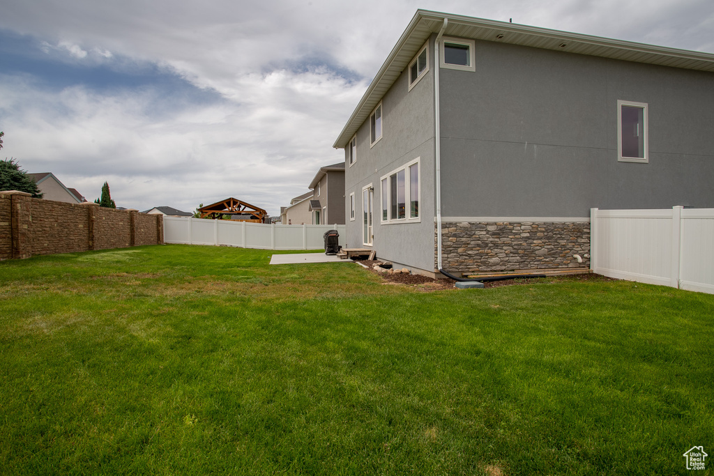 View of fenced backyard