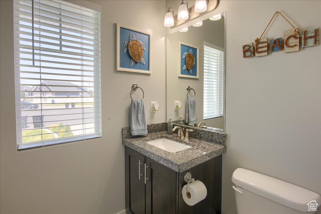 Bathroom with plenty of natural light and vanity