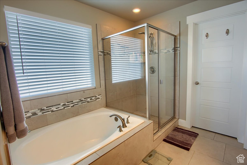 Full bath featuring a bath, a shower stall, tile patterned flooring, and recessed lighting