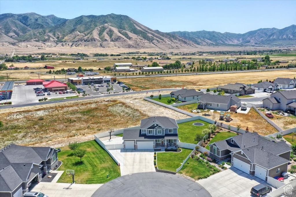 Aerial perspective of suburban area with a mountain backdrop
