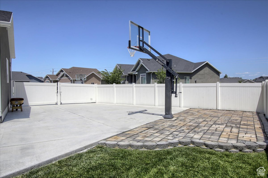 Fenced backyard featuring a patio