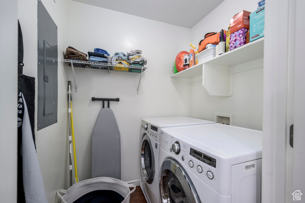 Laundry area with washer and dryer and electric panel