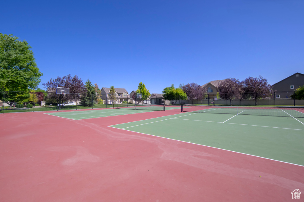 View of tennis court with community basketball court