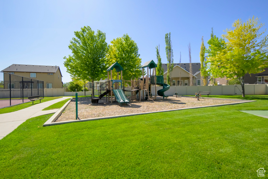 Community jungle gym with a residential view