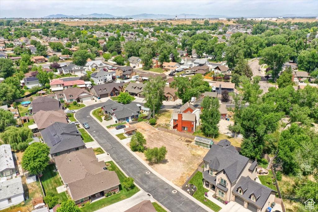 Aerial perspective of suburban area featuring a mountain backdrop