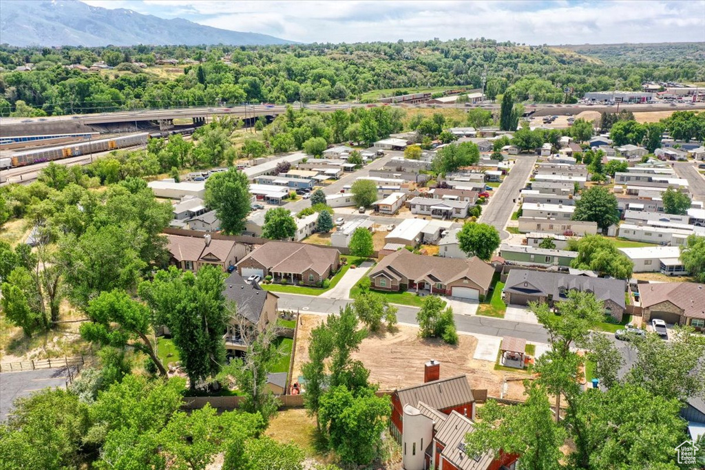 Aerial perspective of suburban area with a mountain backdrop