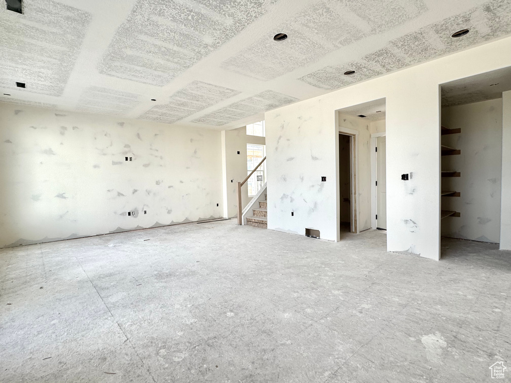 Unfurnished room with stairway
