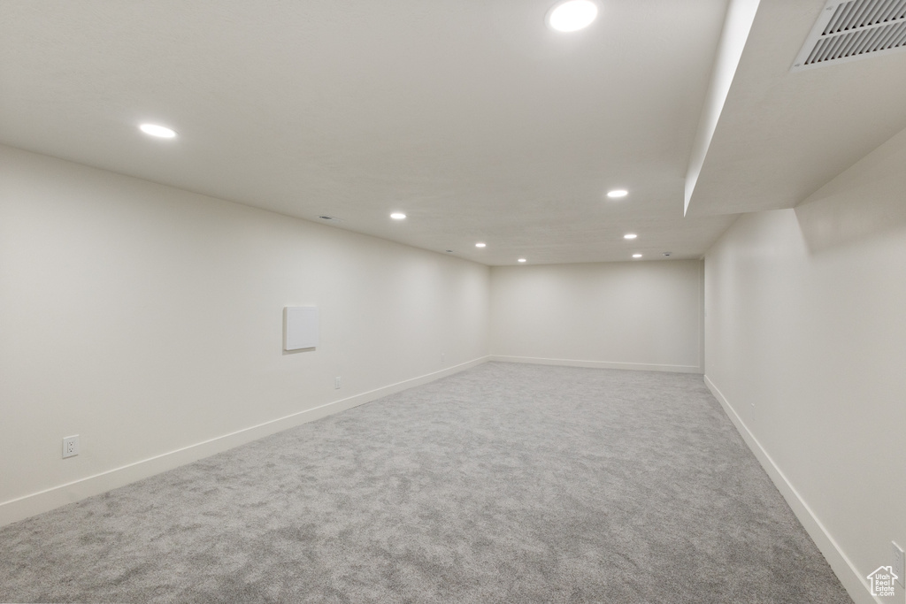 Finished basement featuring recessed lighting and carpet flooring