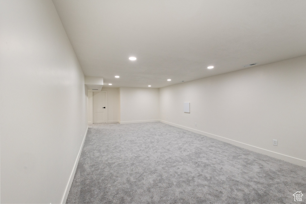 Finished basement with recessed lighting and carpet floors