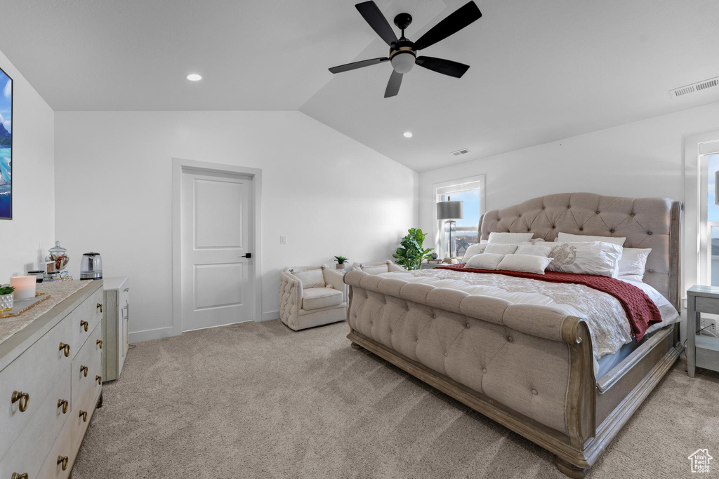 Bedroom featuring light colored carpet, lofted ceiling, recessed lighting, and ceiling fan